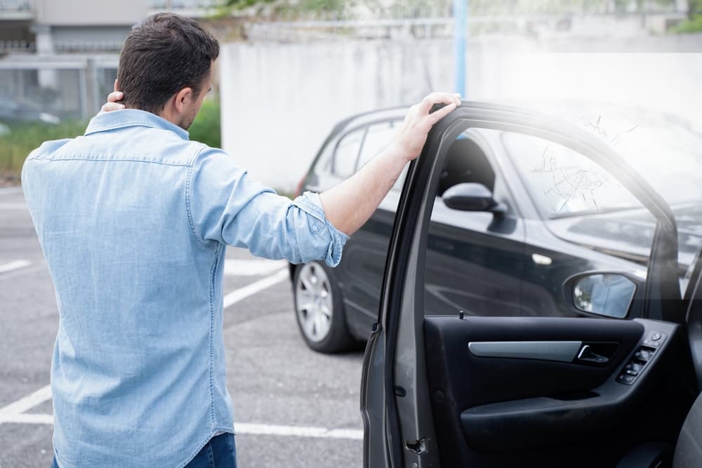 A man experiencing pain following a car accident injury.






